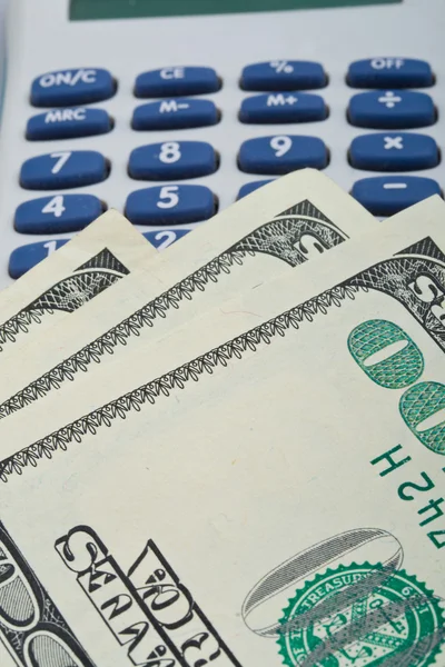 Us dollars over calculator — Stock Photo, Image