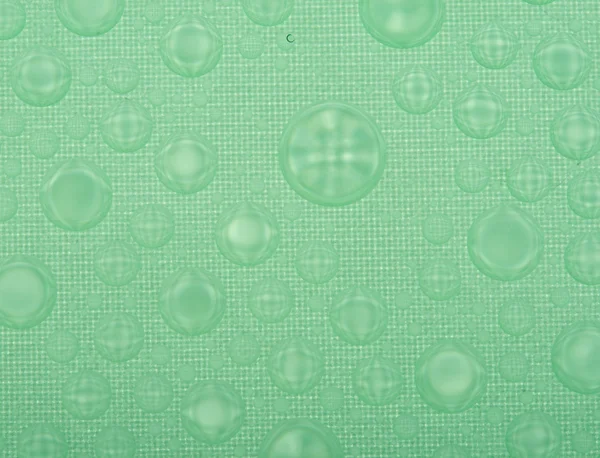 Water druppels op plastic oppervlak — Stockfoto