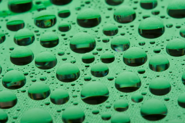 Water druppels op plastic oppervlak — Stockfoto