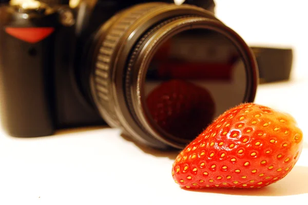 stock image Strawberry and a photo camera