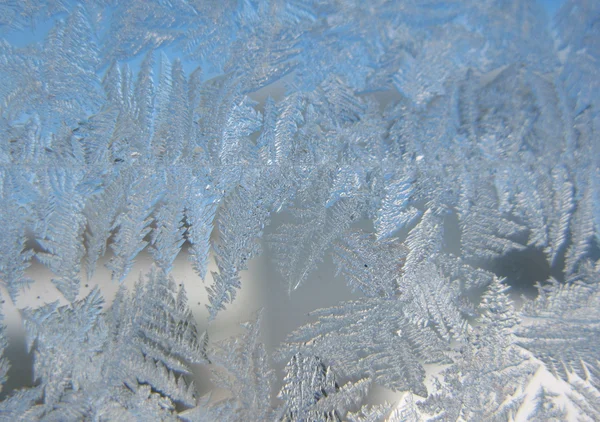 Patrón de nieve en ventana de invierno —  Fotos de Stock