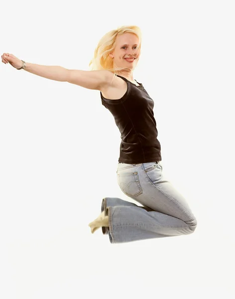 Menina pulando de alegria sobre branco — Fotografia de Stock