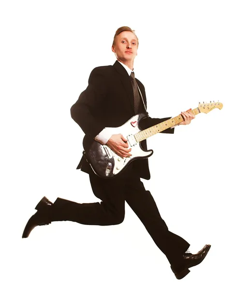 Young man jumping with guitar — Stock Photo, Image