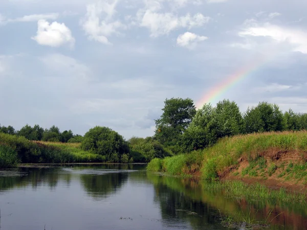 stock image Rainbow over the river.