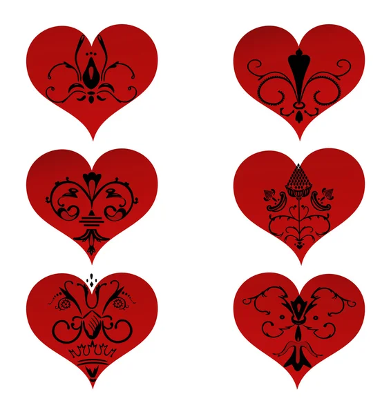 Conjunto de corazones con adorno floral en el interior — Vector de stock
