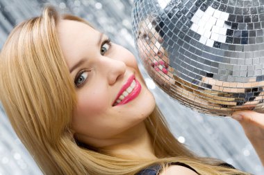 Woman with disco ball over silver backg clipart