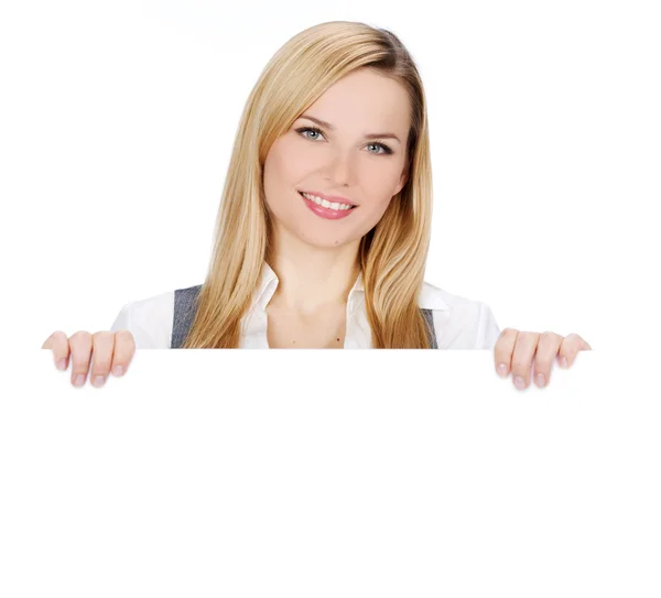 Smiling woman holding blank billboard — Stock Photo, Image