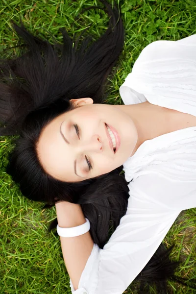 Sexy woman laying on grass — Stock Photo, Image