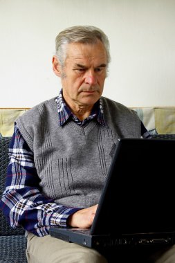 Old man with laptop clipart
