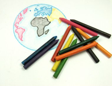 Drawing earth and color chalks clipart