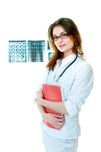 Woman doctor portrait with x-ray films on backgr — Stock Photo, Image