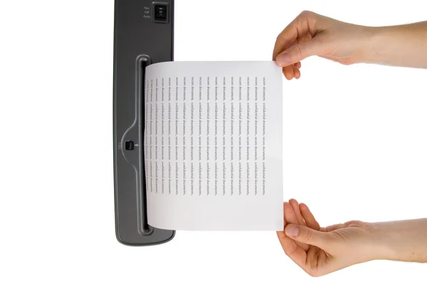 Hand and paper shredder — Stock Photo, Image
