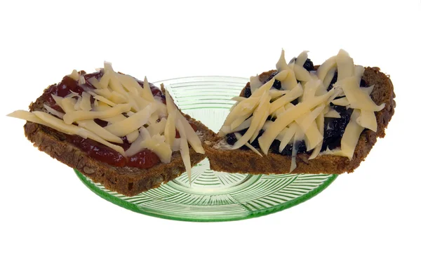 Jam and cheese on a piece of bread — Stock Photo, Image
