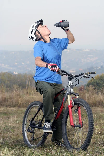 Active biking senior — Stock Photo, Image