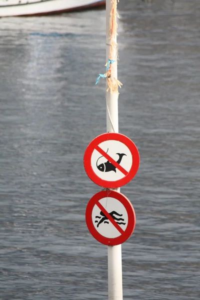 No fishings and no swimming signs — Stock Photo, Image