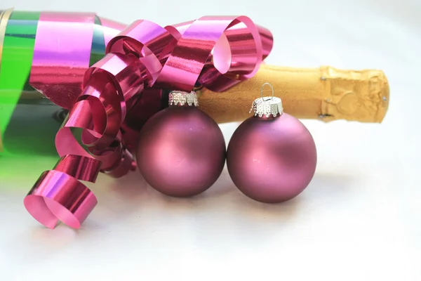 Champagne and purple decorations — Stock Photo, Image