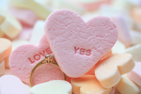 Diamond ring and candy hearts — Stock Photo, Image
