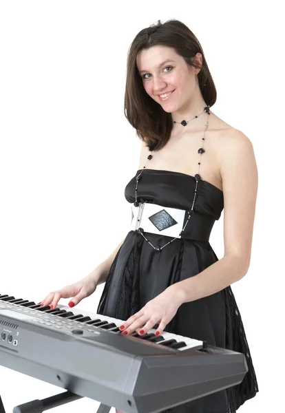 Unga kvinnor spela piano — Stockfoto