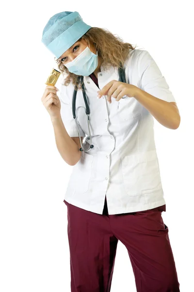 Doctor in mask showing condom — Stock Photo, Image