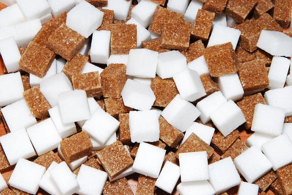 White and brown cubes of sugar — Stock Photo, Image
