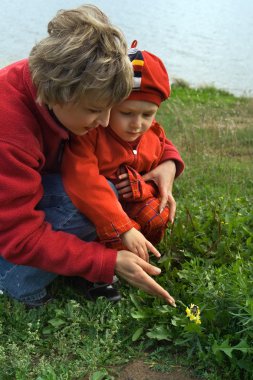 Mother and son on walk clipart