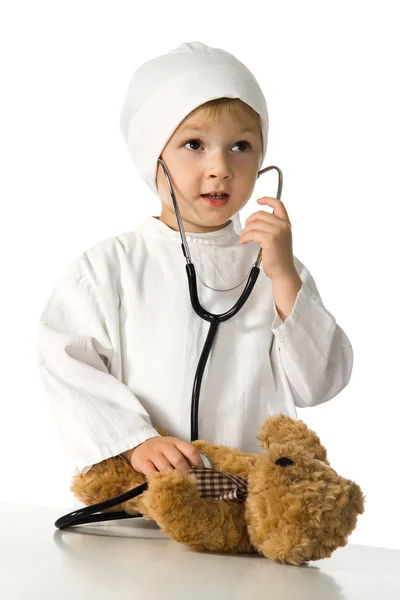 Child plays the doctor Stock Photo