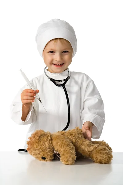 Kind spielt den Arzt Stockbild