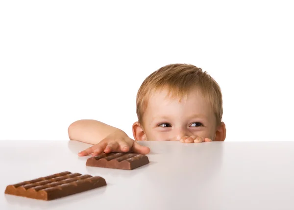 Kind en chocolade Stockfoto