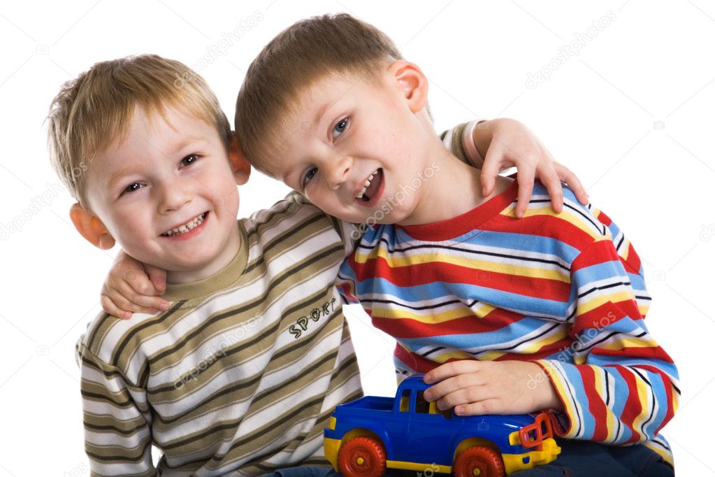 Two young boys cheerfully play