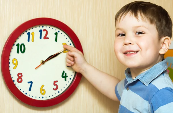 Small boy with clock — Stock Photo, Image