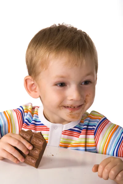Criança com um chocolate — Fotografia de Stock