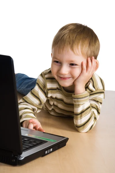 Young boy using a laptop — Stock Photo, Image