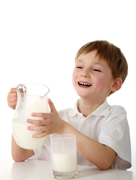 Criança com jarro de leite — Fotografia de Stock