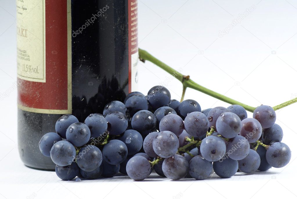 Grapes and the bottle of wine.