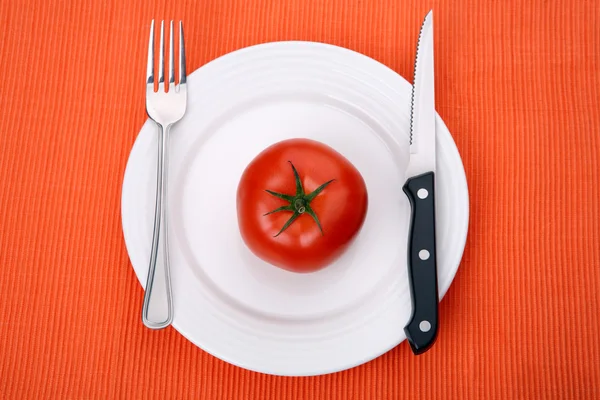 Empty plate on orange background — Stock Photo, Image