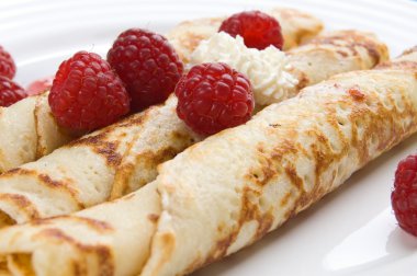 Pancakes with cream and raspberries clipart