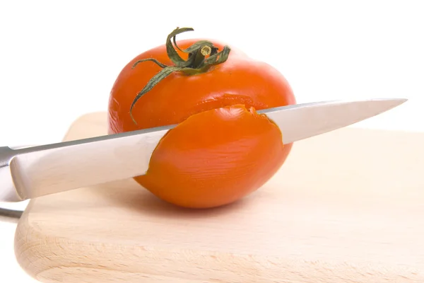 Tomatoes on cutting board — Stock Photo, Image