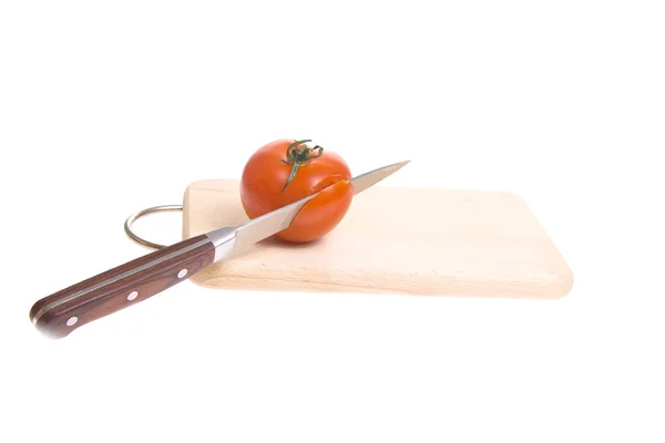 Tomatoes on cutting board — Stock Photo, Image