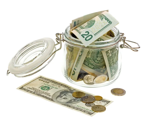 Verschillende geld in de glazen pot — Stockfoto