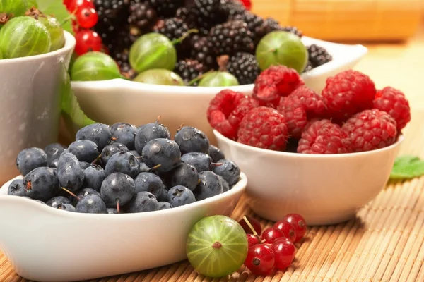 Berries in plates, on a table — Stock Photo, Image