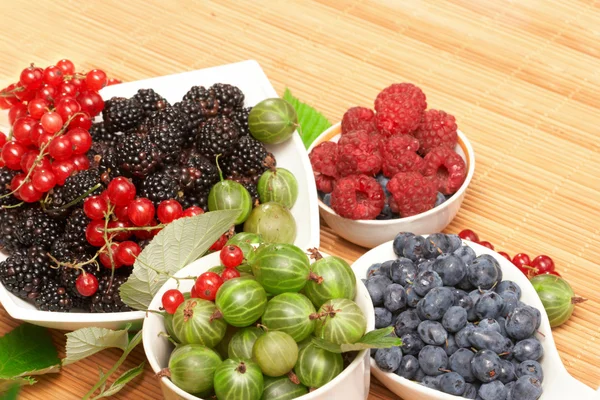 Berries in plates, on a table — Stock Photo, Image