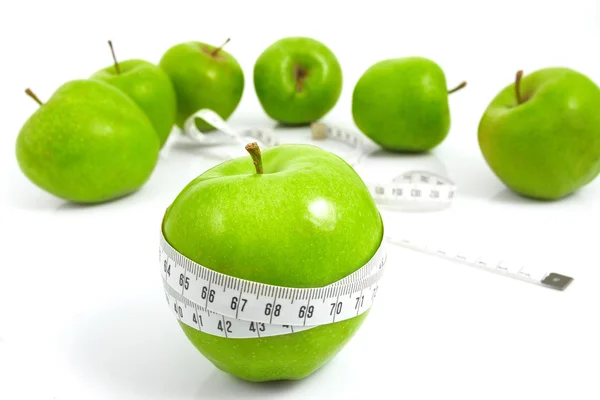 Jablka zelená sportovní měří metr — Stock fotografie