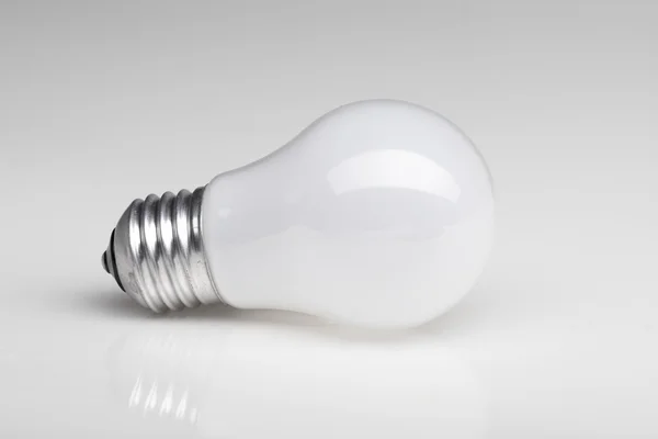 Bakgrund med glödlampa — Stockfoto