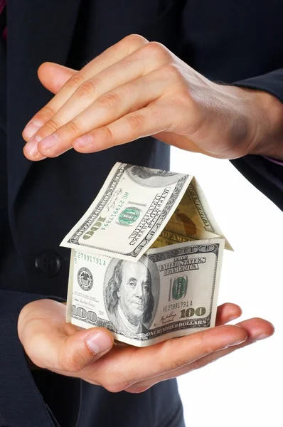 เงินในบ้านในมือมนุษย์ — ภาพถ่ายสต็อก