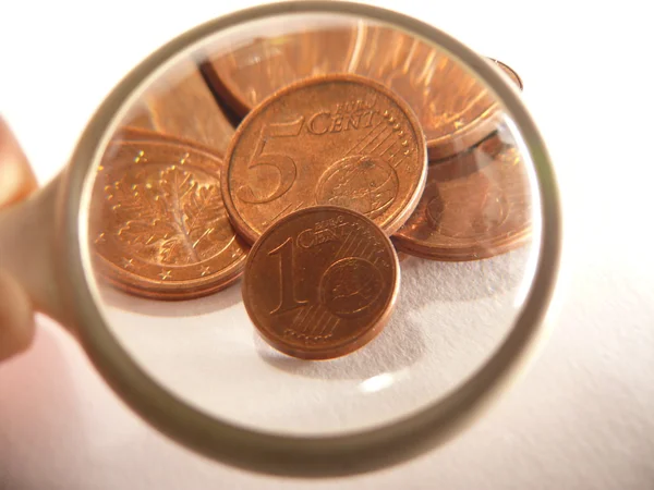 Euro cents under magnifying glass — Stock Photo, Image