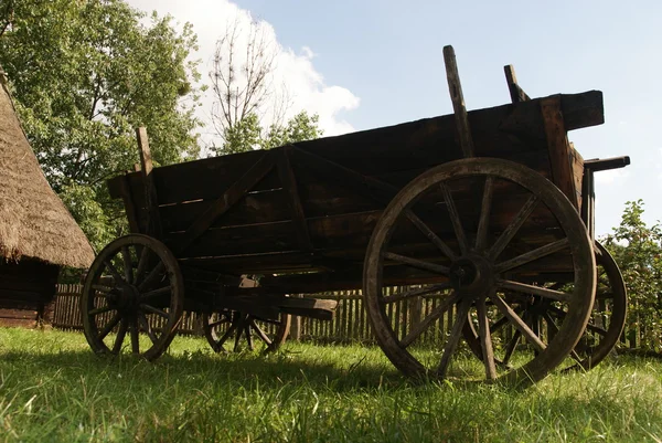 Old wood cart on grass — Stock Photo, Image