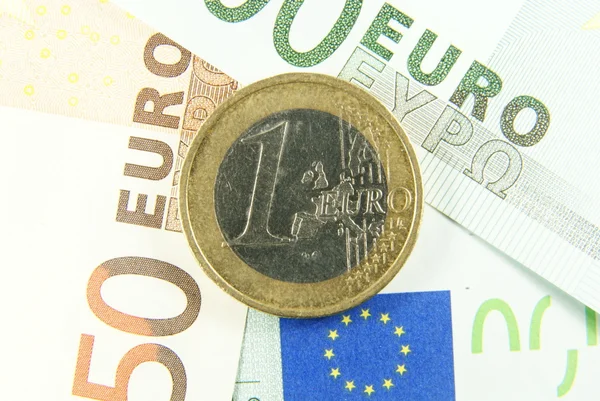 One euro coin on euro cash. — Stock Photo, Image