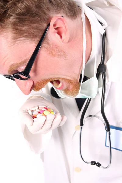 Médico tomando a mão cheia de comprimidos — Fotografia de Stock