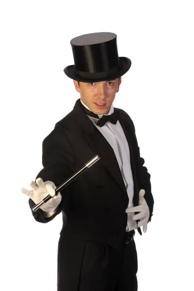 Young magician performing with wand Stock Photo