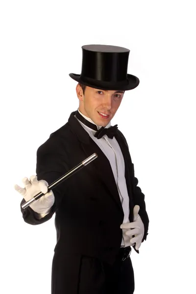 Young magician performing with wand Royalty Free Stock Images
